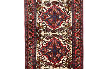 An oriental runner carpet, c. 295 x 95 cm.