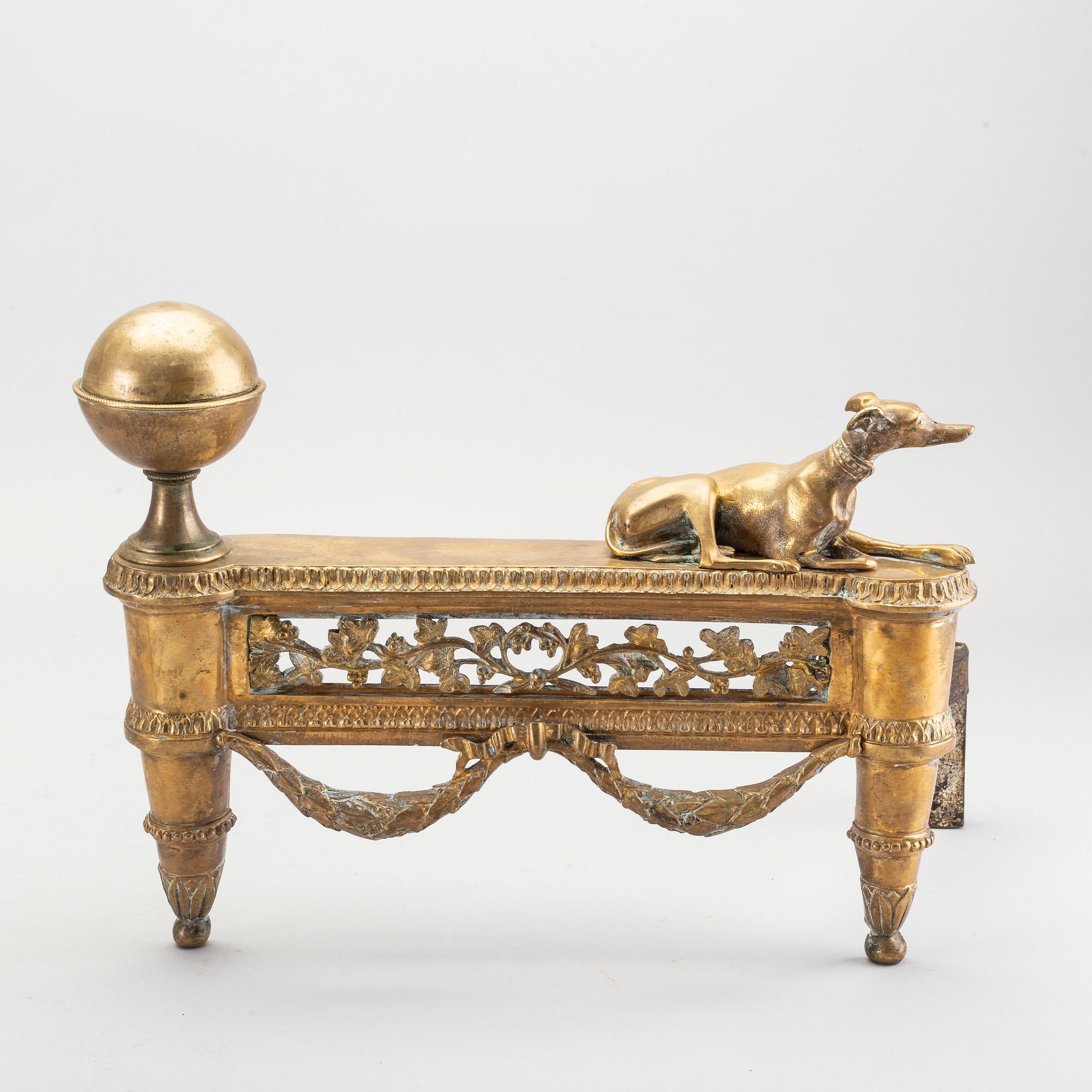 A pair of Louis XVI 18/19 century fire dogs.