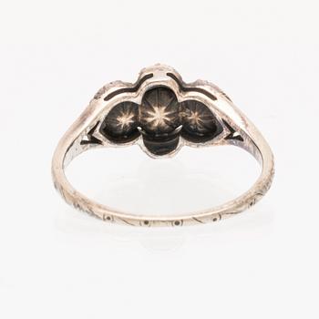 An 18K white gold ring set with rose cut diamonds.