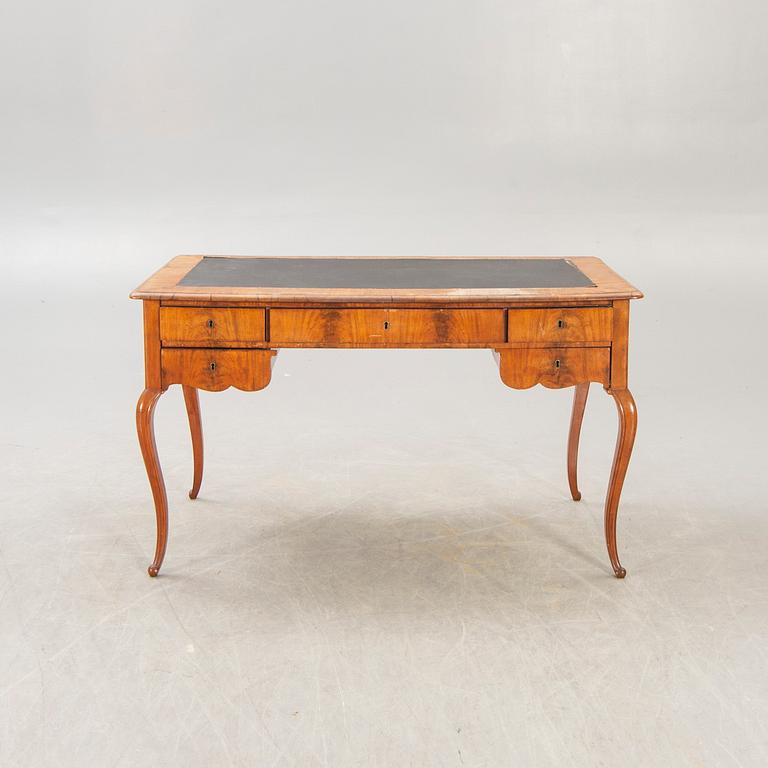 A Neo Rococo walnut desk later part of the 20th century.