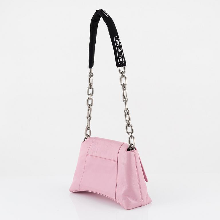 Balenciaga, a pink leather 'Downtown' bag.