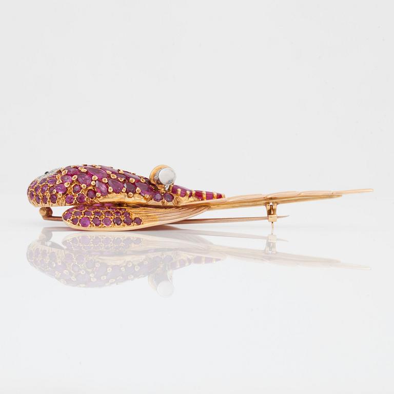 A ruby and single-cut diamond brooch in the shape of a parrot.