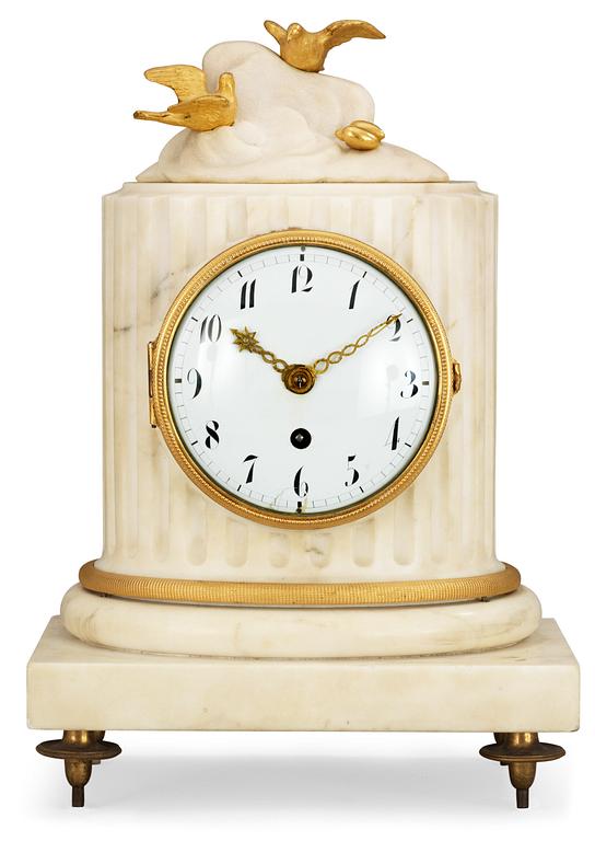 A Louis XVI late 18th century marble and gilt bronze mantel clock.