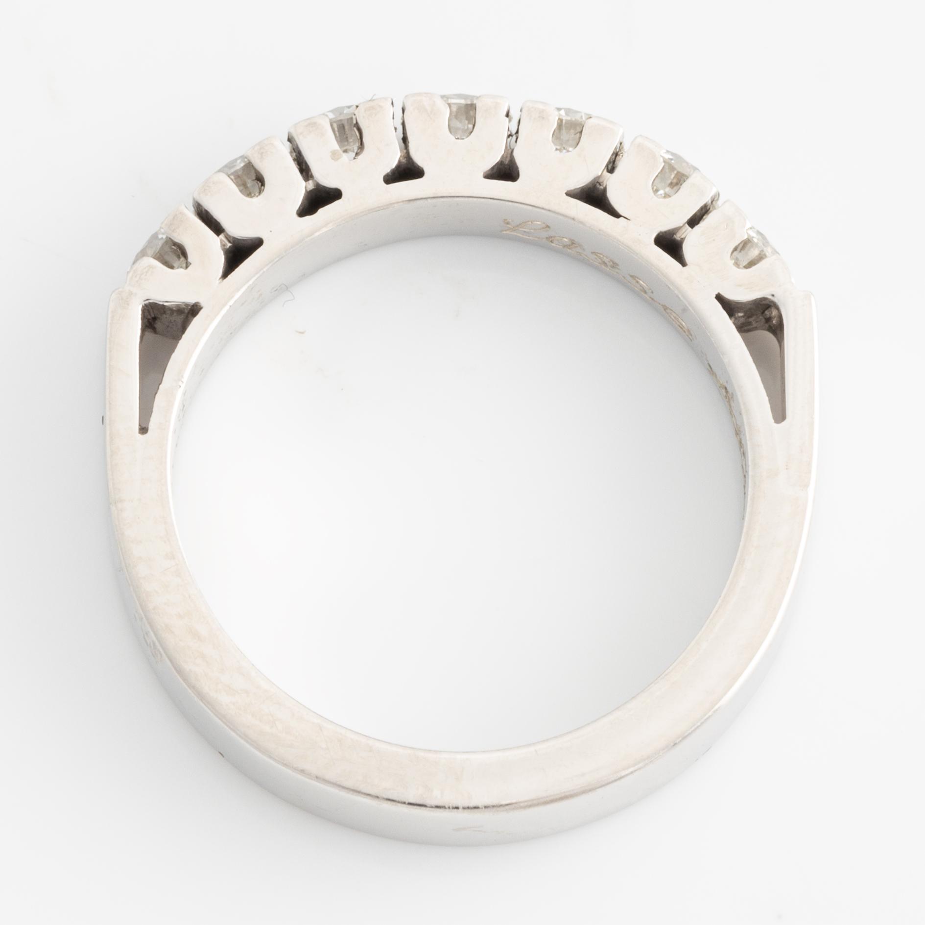 Half-eternity ring with brilliant-cut diamonds.