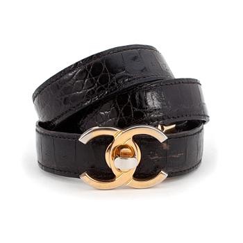 616. CHANEL, a black crocodile belt. Size 80/32.