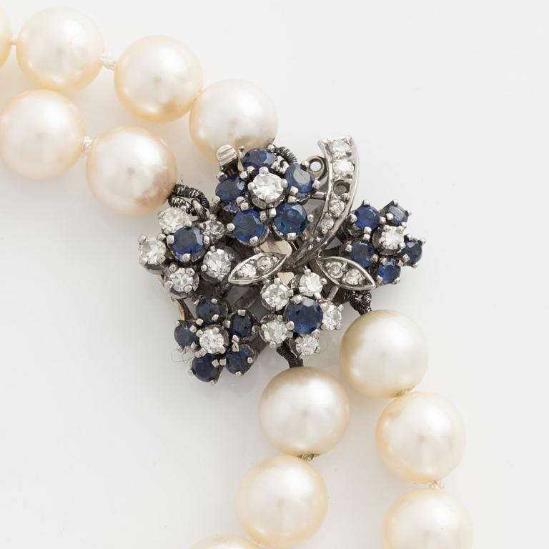 Pearl necklace, two rows, cultured pearls, clasp with diamonds and sapphires.