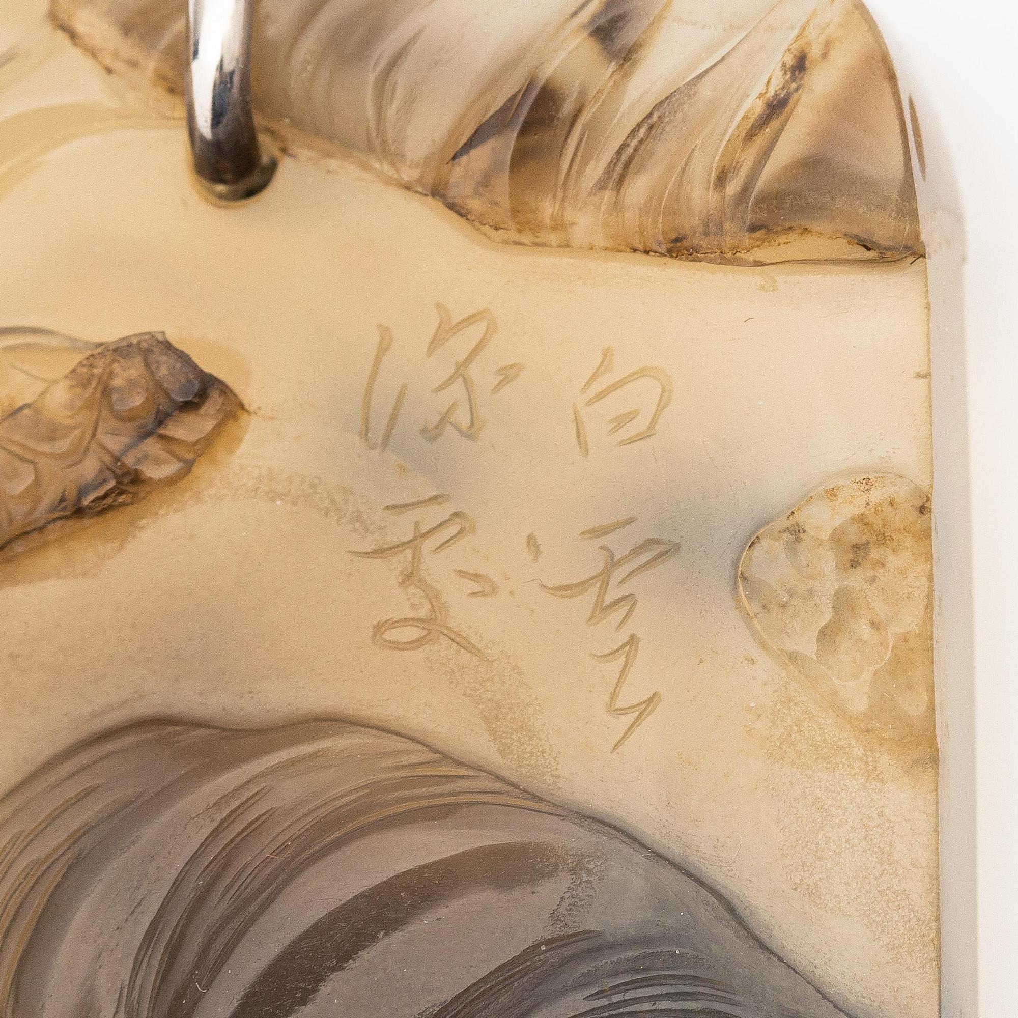 An inscribed and well carved agate 'Scholar and attendant' pendant, Qing dynasty, probably 19th century.