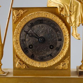 A French Empire gilt bronze mantel clock, early 19th Century.