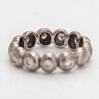 An 18K white gold eternity ring, with brilliant-cut diamonds totalling approximately 0.39 ct.