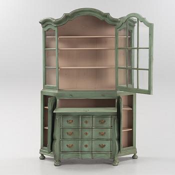 A Rococo cabinet with vitrine top.