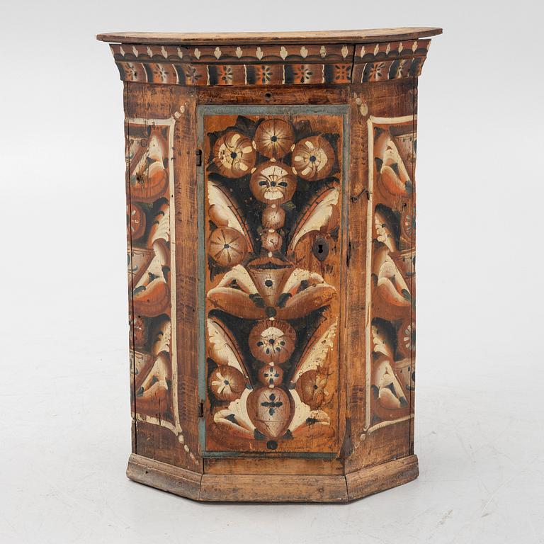 A Swedish traditional painted corner cabinet, Dalarna, 18th-/19th century.