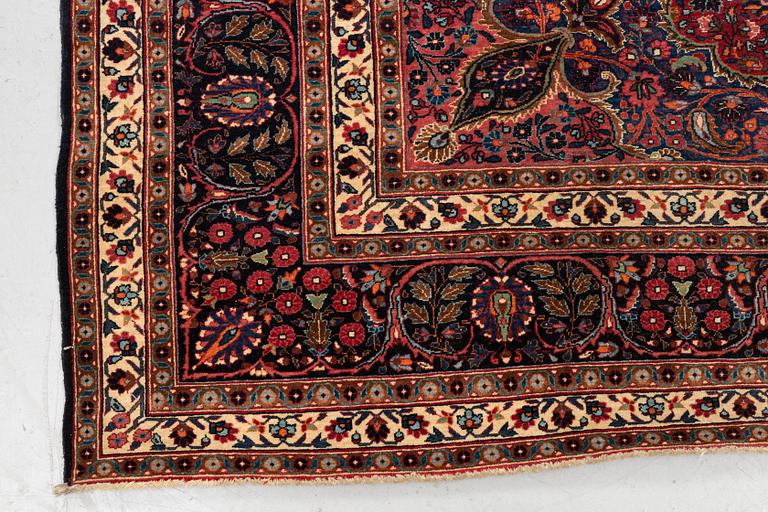 A carpet, semi-antique Mashad/Moud, ca 292 x 214 -218 cm.