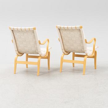 A pair of 'Eva' easy chairs by Bruno Mathsson, for Bruno Mathsson International, dated 2009.