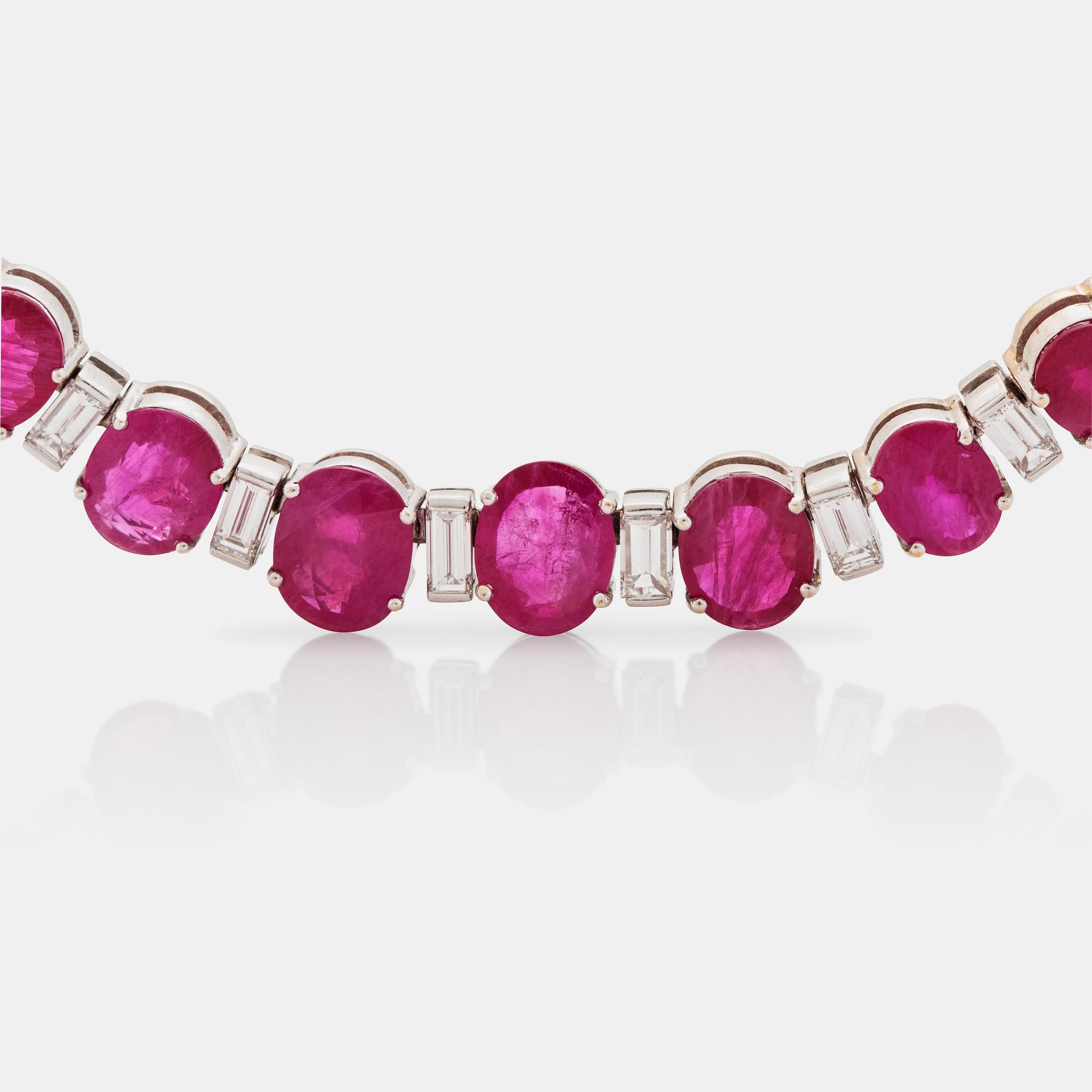 A ruby and baguette cut diamond rivière necklace by Demner New York. Total carat weight of diamonds circa 9.00 cts.