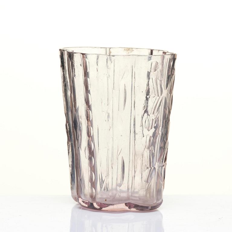 An amethyst coloured suger shaker and a cut glass goblet, 18th century.