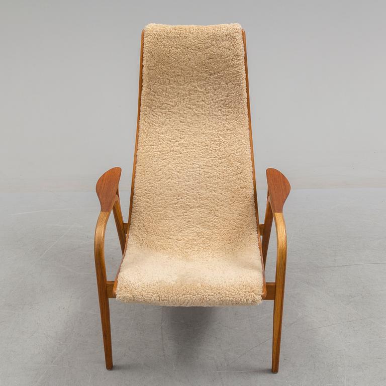 A Yngve Ekström teak and oak armchair.