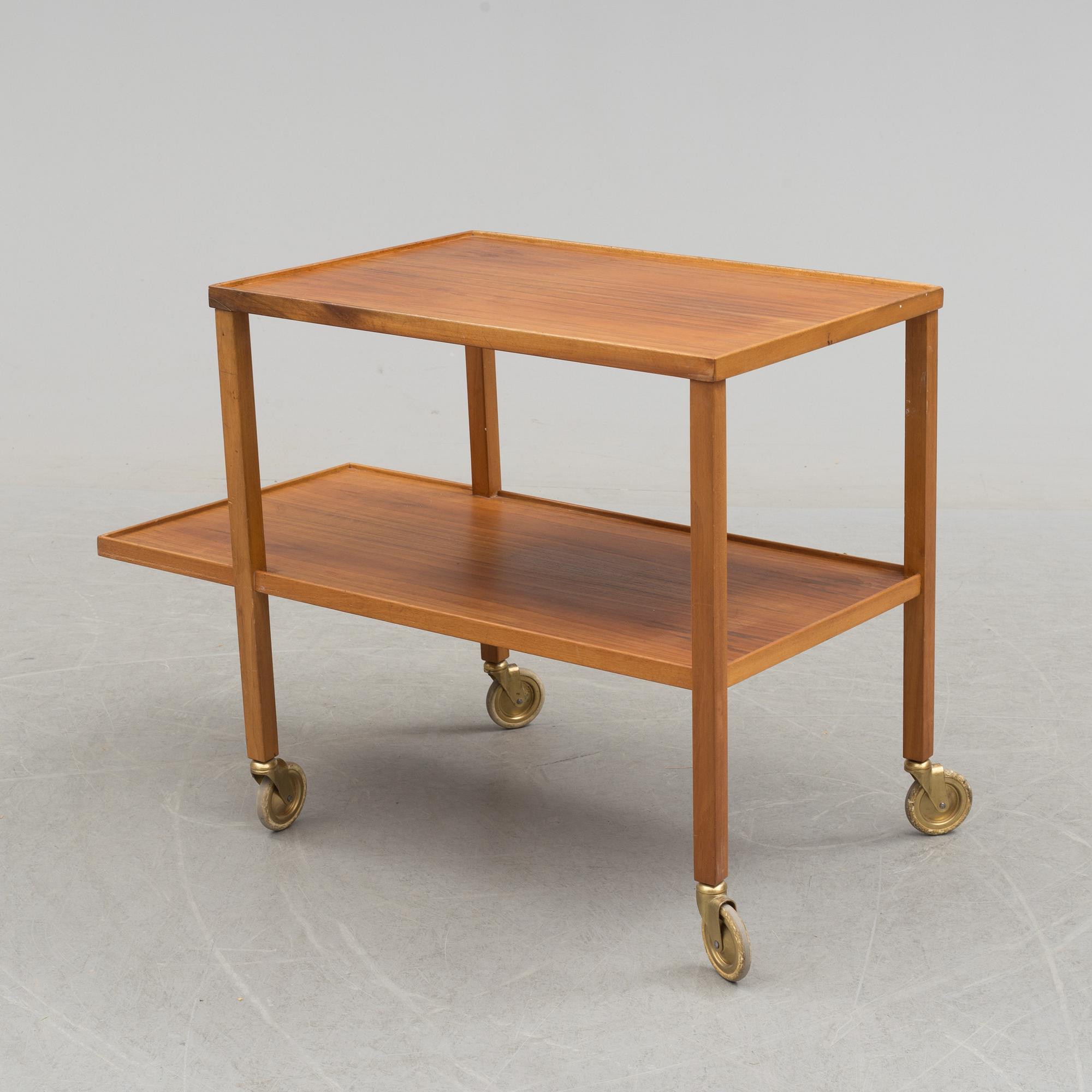 A walnut tea trolley model 470 by Josef Frank for Firma Svenskt Tenn.