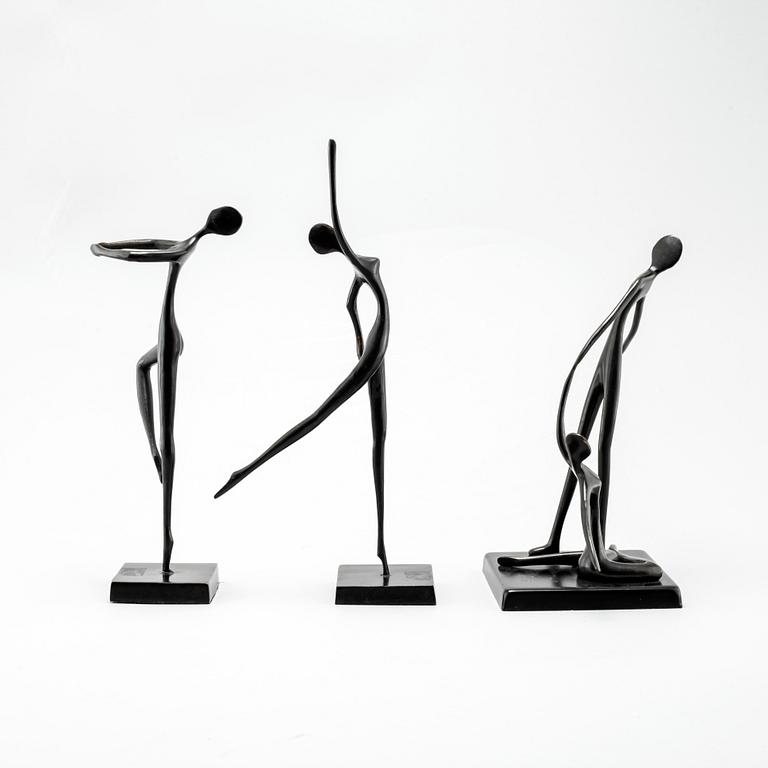 Three patinated bronze sculptures designed by Bodrul Khalique.