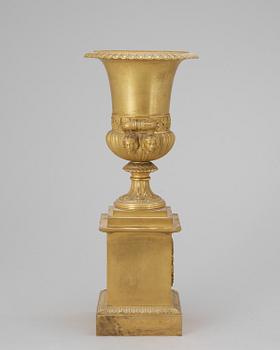 A French Empire bronze urn, early 19th century.