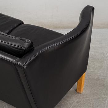 An 'AV59' sofa by Arne Vodder, Nielaus, Denmark.