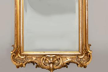 A Swedish Neo Rococo gilded signed mirror 1880s.