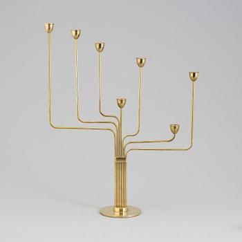 PIET HEIN, a "Ursa Major" brass candelabra, designed 1953.