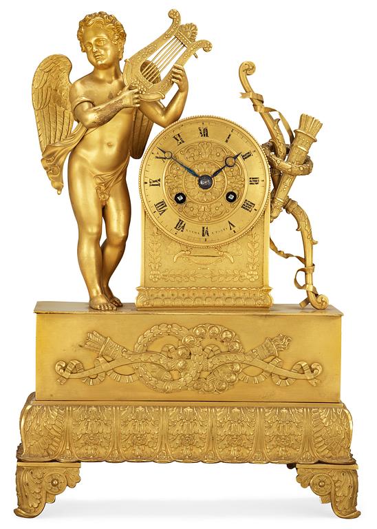 A French late Empire gilt bronze mantel clock, by G. Rouma.