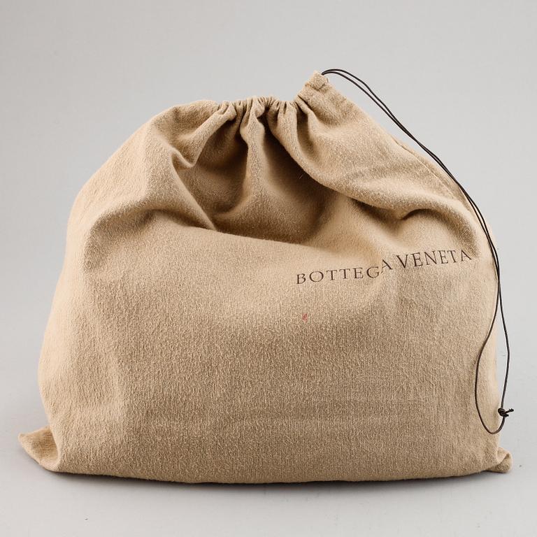 Bottega Veneta, a black leather bag.