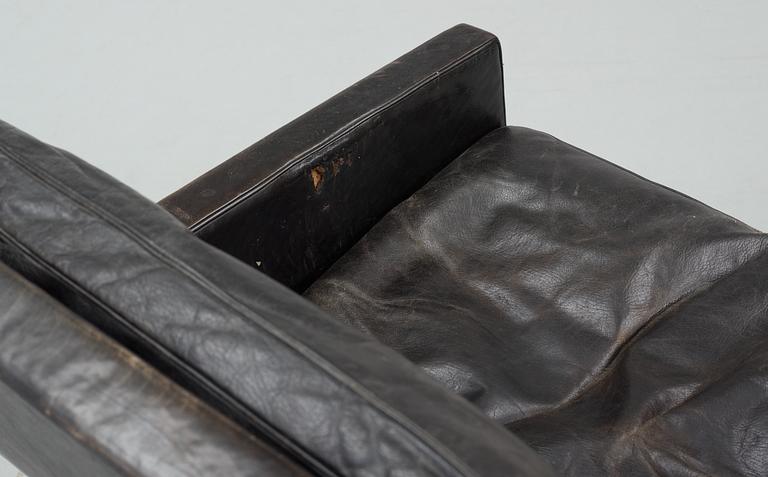 A Poul Kjaerholm black leather and steel base "PK-31-2" sofa, maker's mark E Kold Christensen, Denmark.