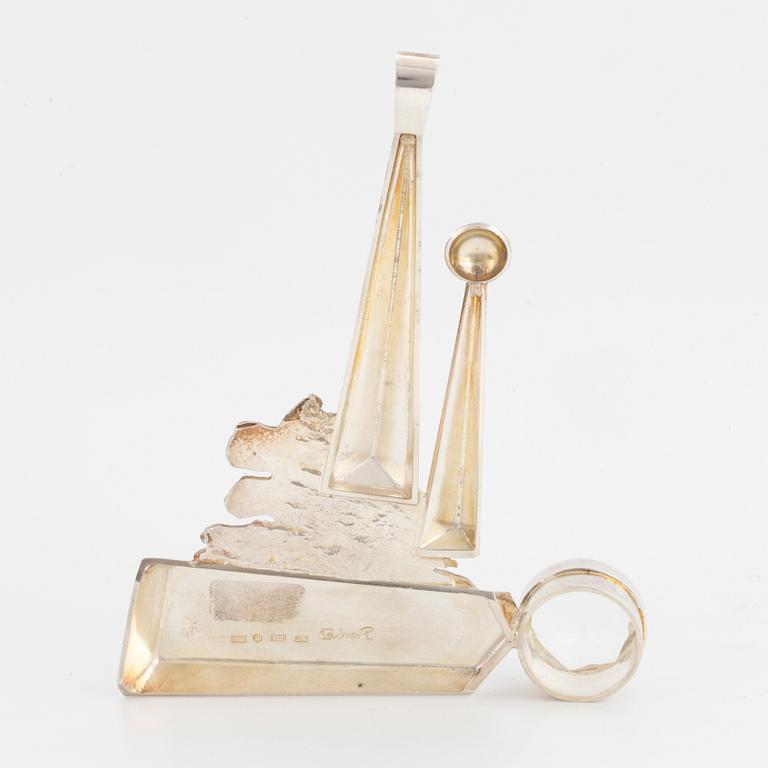 A Rolf Karlsson sterlingsilver + 18K gold and round faceted rock crystal pendant.