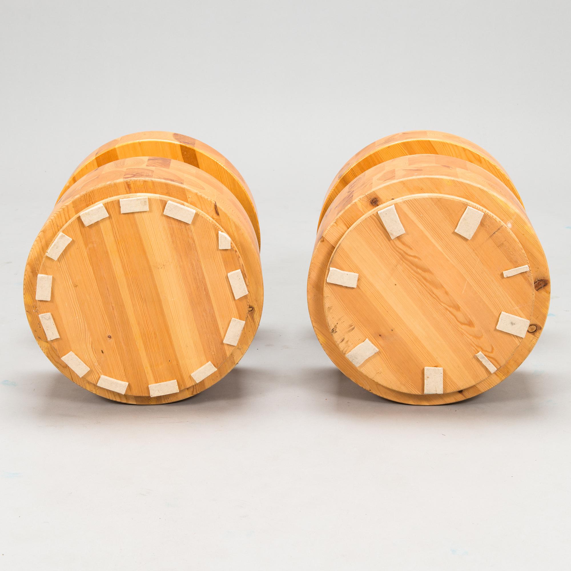 A pair of Finnish pinewood stools/ sidetables, late 20th century.