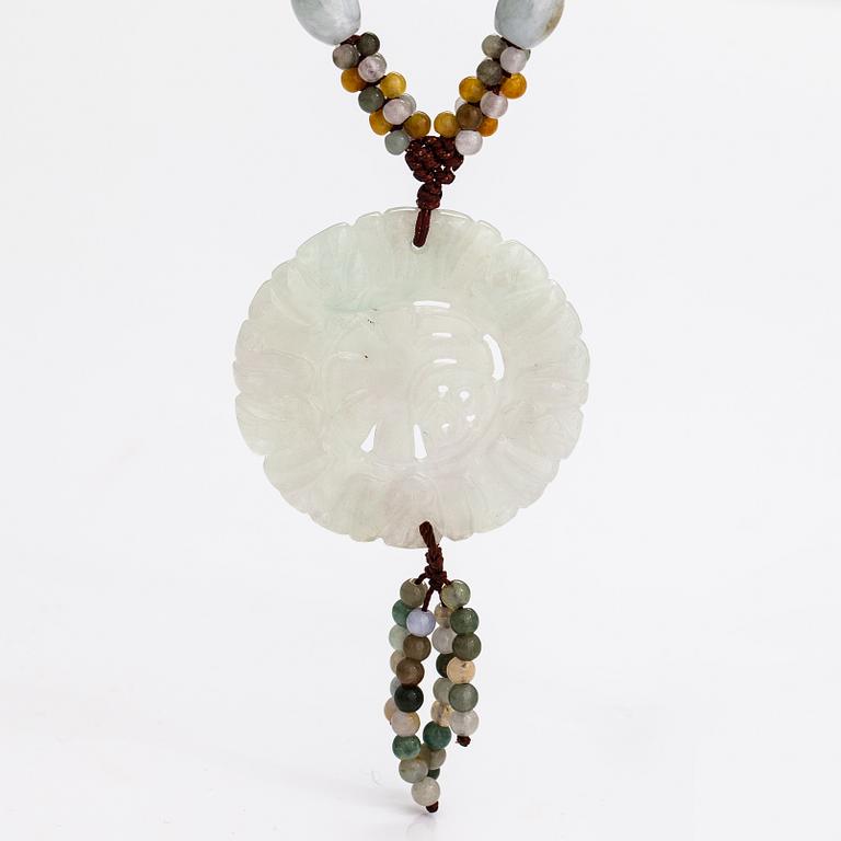 A collier with jade and nyon cord.