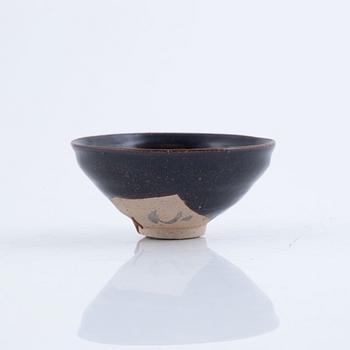 A tenmoku glazed Song style bowl, probably later.