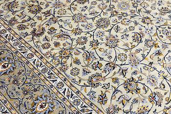A Keshan carpet, signed, 397 x 302 cm.