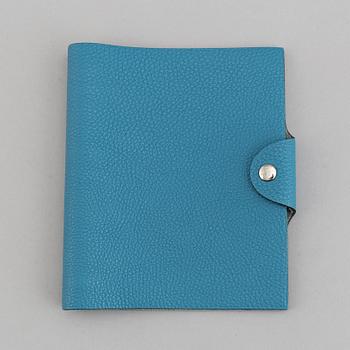 Hermès, a blue leather notebook with two scripple pads.