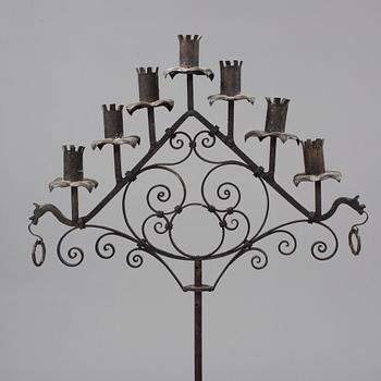 A metal floor candelabra, first half of the 20th century.