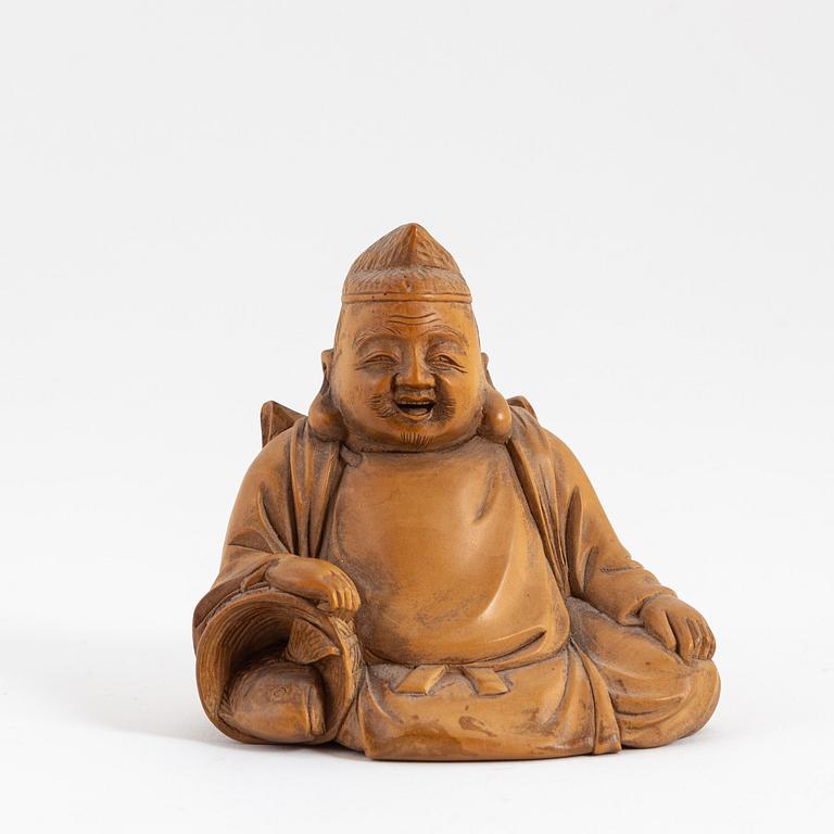 A fine Japanese boxwood okimono in the shape of the God Ebisu, 20th century.