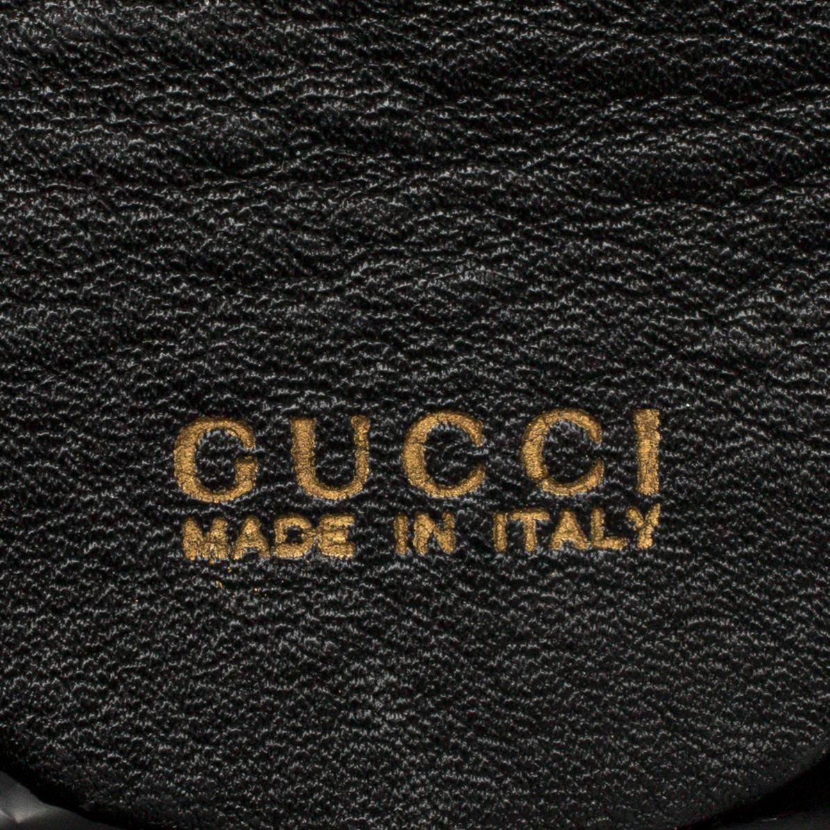 GUCCI, a leather bag/briefcase.
