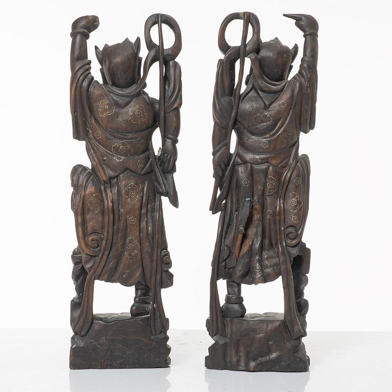 A pair of Chinese hardwood figures, 20th century.