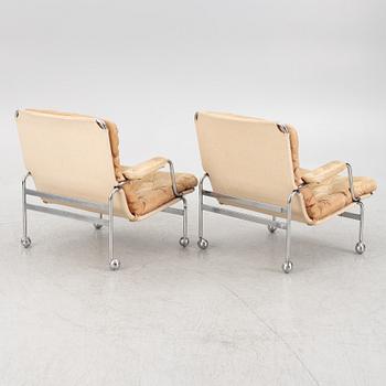 Bruno Mathsson, a pair of "Karin" armchairs, Dux, Sweden, late 20th century.