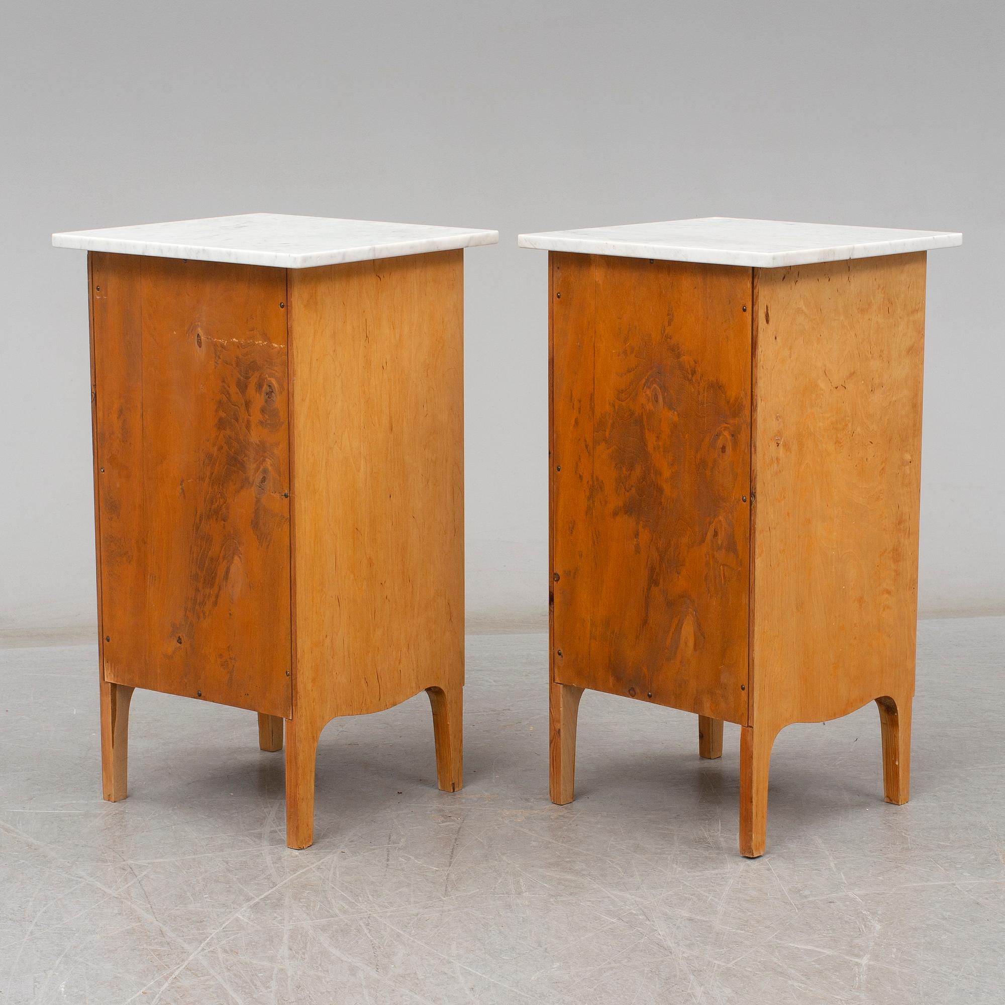 A pair of birch and marble top bedside tables, possibly  Axel Ståhls Möbelfabrik, Vimmerby, 1910's/20's.
