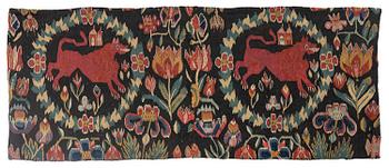 327. A cushion, 'Red Lion' (Rött Lejon), tapestry weave, ca 86 x 36 cm, southwestern Scania, first part of the 19th century.