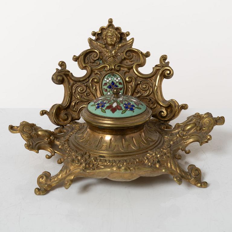 A pair candlesticks and an inkwell, circa 1900.