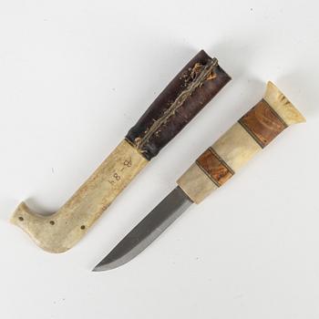 A rendeer horn knife and two spoons, unidentified signature AB.