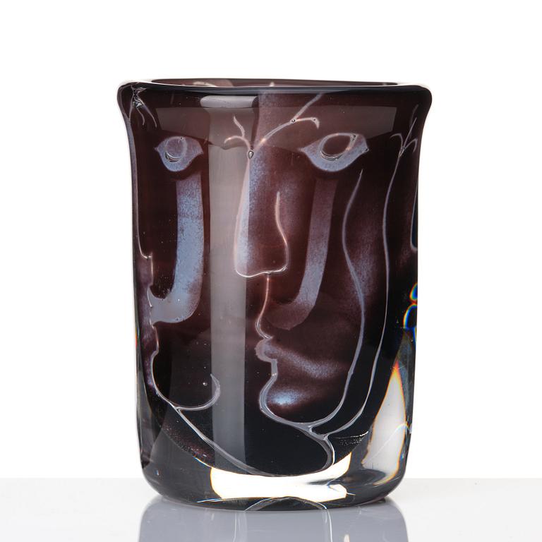 Ingeborg Lundin, an 'ariel' burgundy coloured glass vase decorated with faces, Orrefors Sweden 1972.