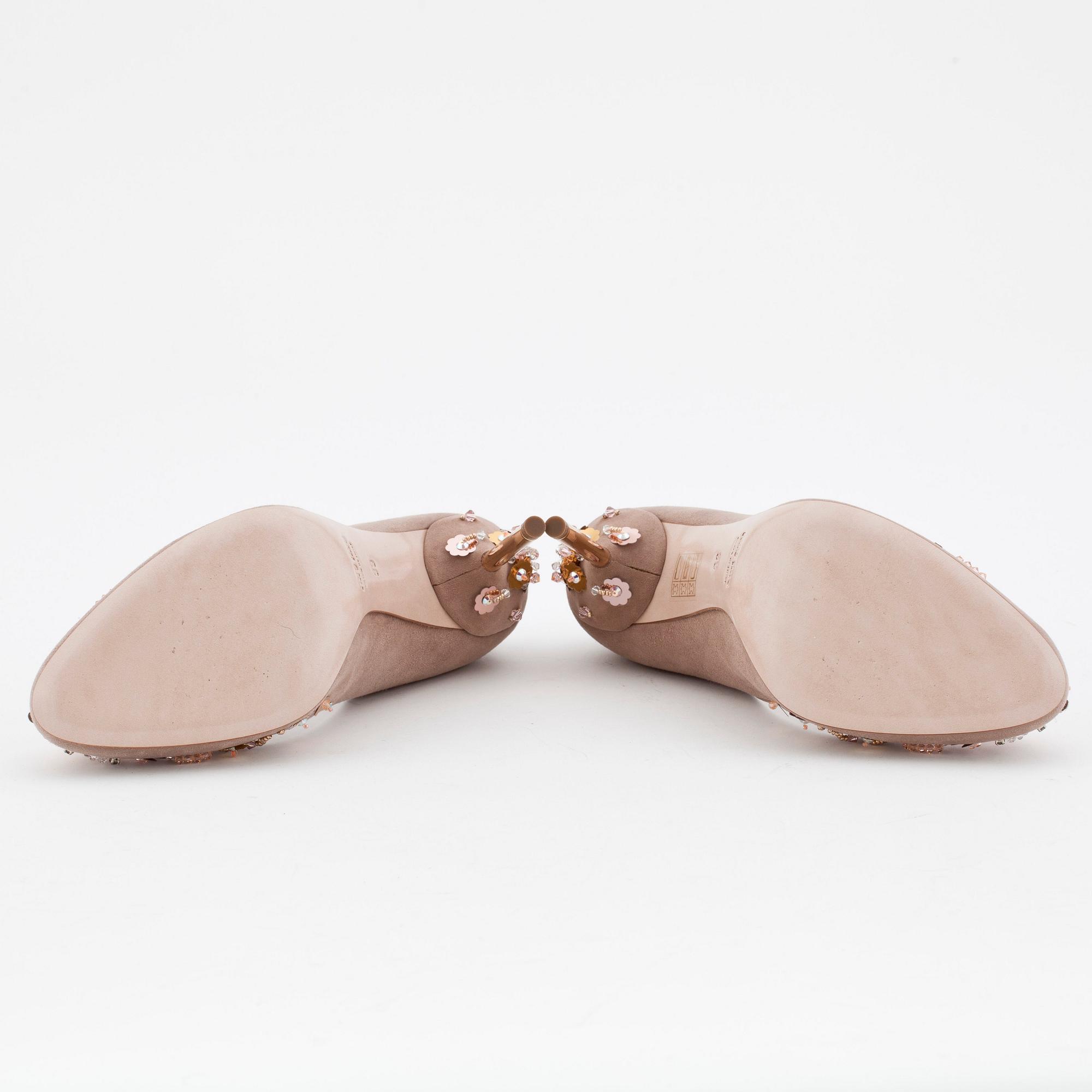 MIU MIU, a pair of beige suede pumps with sequined embellishment.