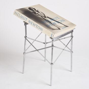 Helmut Newton, Signed book published by Taschen, Monte Carlo, 1999, ed 10000, with a metal table.