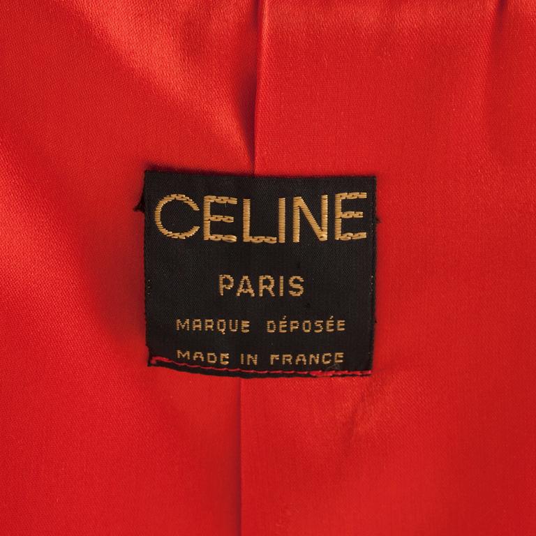 CÉLINE, a red cashmere and wool coat.