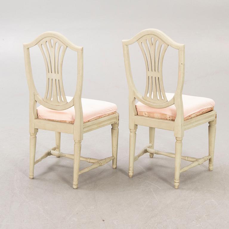 A öpair of painted Gustavian chairs.