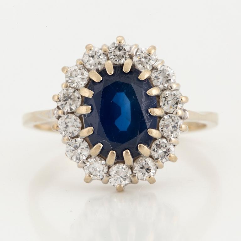 A sapphire and brilliant-cut diamond ring.